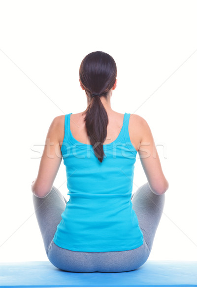 Stock photo: Woman doing yoga rear view