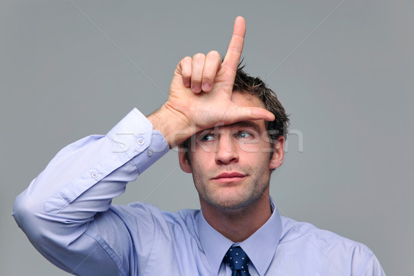 Biznesmen przegrywający gest strony człowiek Zdjęcia stock © RTimages