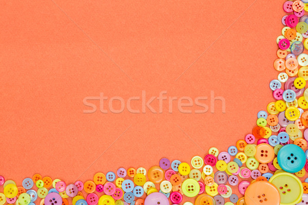 Colourful buttons on an orange background with copy space. Stock photo © RTimages