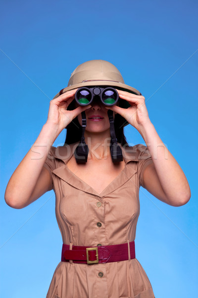 Stock photo: Woman in safari hat looking through binoculars