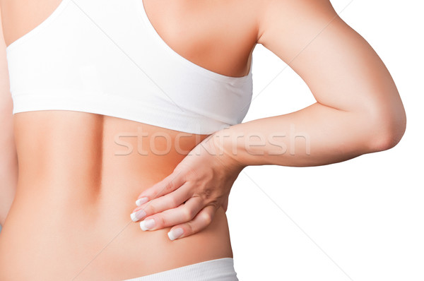 Hátfájás fiatal nő fájdalom alsó hát nő Stock fotó © ruigsantos