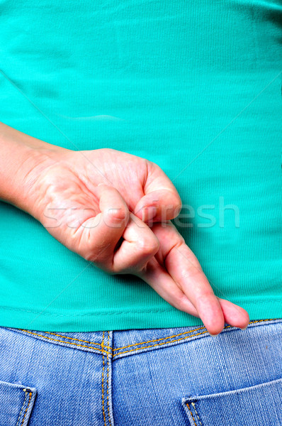 Finger hinter Jeans weiblichen Geschichte Stock foto © ruigsantos