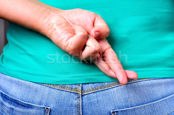 Finger hinter Jeans weiblichen Geschichte Stock foto © ruigsantos