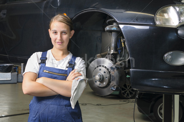 Kobiet samochodu mechanik patrząc dumny niebieski Zdjęcia stock © runzelkorn