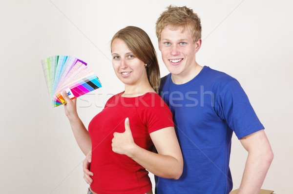 Young couple looking out the wall color Stock photo © runzelkorn