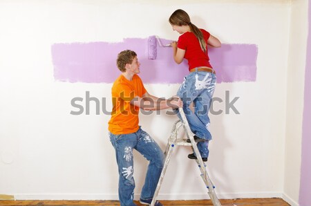 Stock photo: Young woman renovated their home