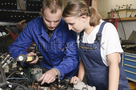Apprentice and master in garage Stock photo © runzelkorn