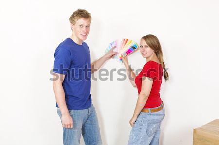Young couple looking out the wall color Stock photo © runzelkorn