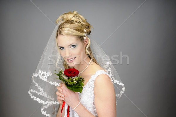 Smiling bride with bouquet Stock photo © runzelkorn