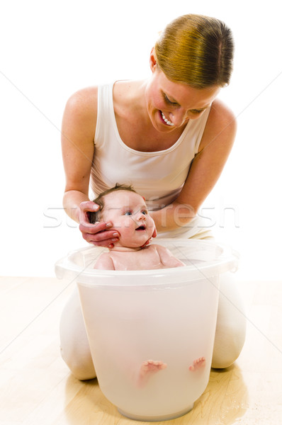 Mom bathing cute baby girl Stock photo © runzelkorn