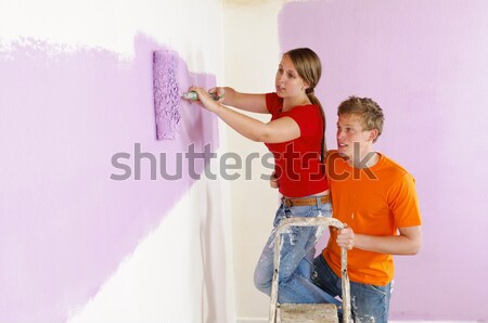 Stock photo: Young woman renovated their home
