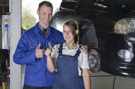 Pneumatici garage femminile auto meccanico blu Foto d'archivio © runzelkorn