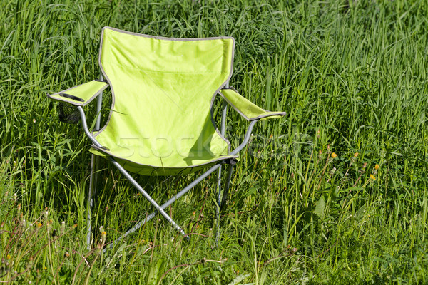 Green folding chair on the grass Stock photo © RuslanOmega