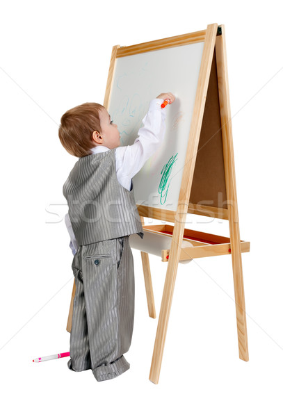 A child paints on an easel in the studio Stock photo © RuslanOmega