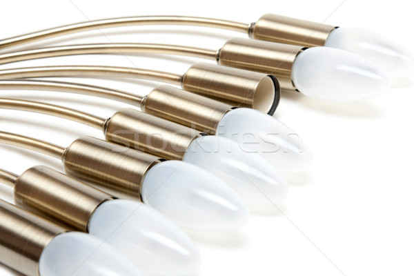 Electric light bulbs in golden patron Stock photo © RuslanOmega