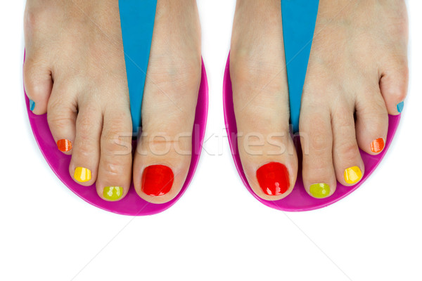 Beautiful female feet with a pedicure color Stock photo © RuslanOmega