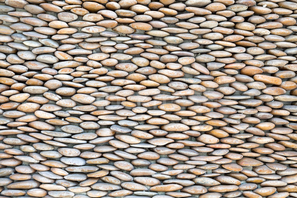 stone wall, lined with pebbles Stock photo © RuslanOmega
