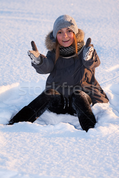 Gyönyörű fiatal lány ül hó nő boldog Stock fotó © RuslanOmega