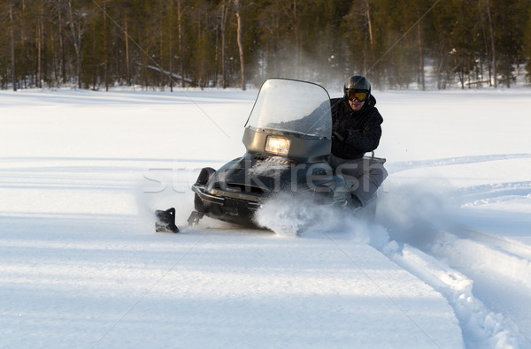 man riding a snowmobile Stock photo © RuslanOmega