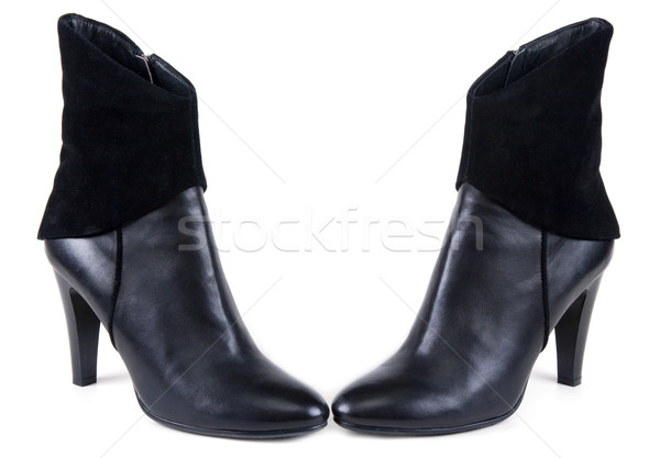 Stock photo: Black feminine leather boots with suede insertion
