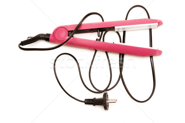 Stock photo: Electric pink hair straightener
