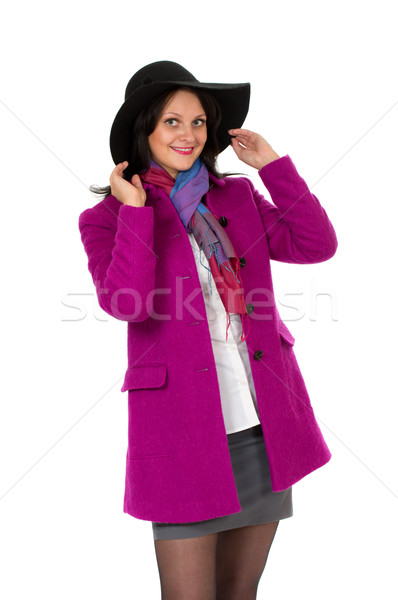 Cheerful girl in a coat and hat Stock photo © RuslanOmega