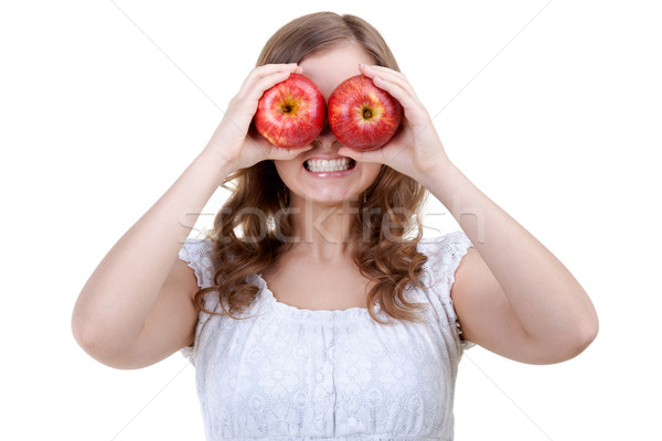 Woman holding two red apples for eyes Stock photo © RuslanOmega