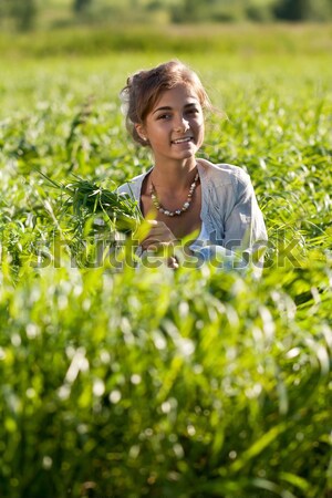 girl with a bundle of green grass Stock photo © RuslanOmega