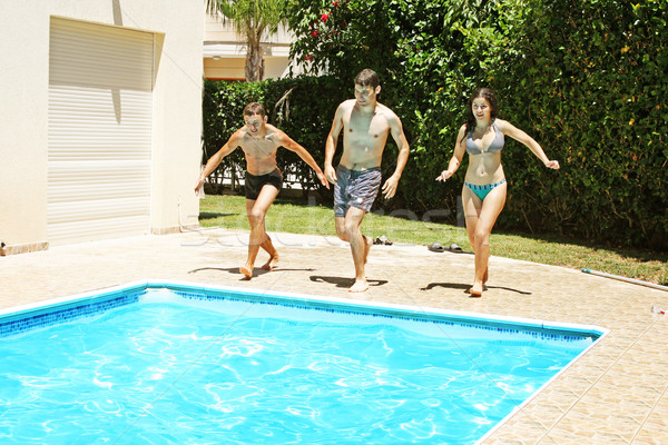 Persone jumping piscina acqua ragazza uomo Foto d'archivio © ruzanna