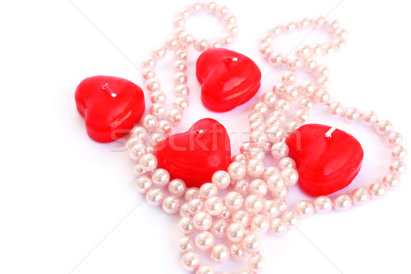 Stock photo: Red candles and necklace