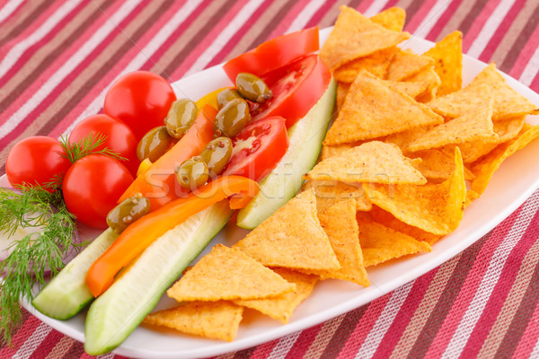 Vegetables, olives, nachos in plate Stock photo © ruzanna