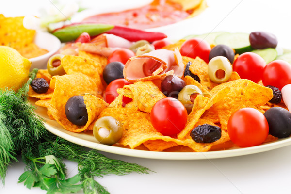 Stock photo: Nachos, olives, pork loin and vegetables
