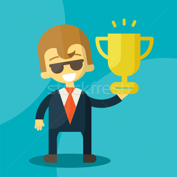 Young businessman lifts trophy Stock photo © sabelskaya