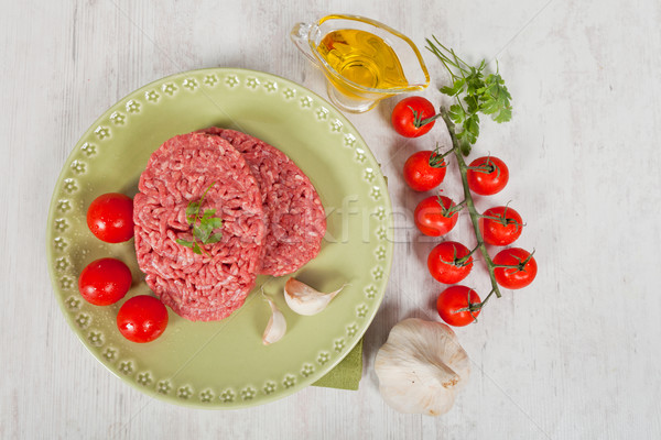 Nyers hamburger friss hús petrezselyem felszolgált Stock fotó © sabinoparente