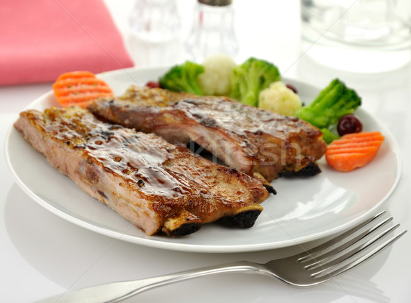 Disznóhús borda barbecue szósz tűz vacsora tányér Stock fotó © saddako2