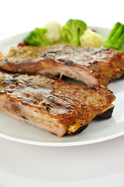 Disznóhús borda barbecue szósz tűz vacsora tányér Stock fotó © saddako2