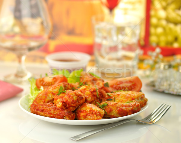 Stock photo: hot chicken wings with salad