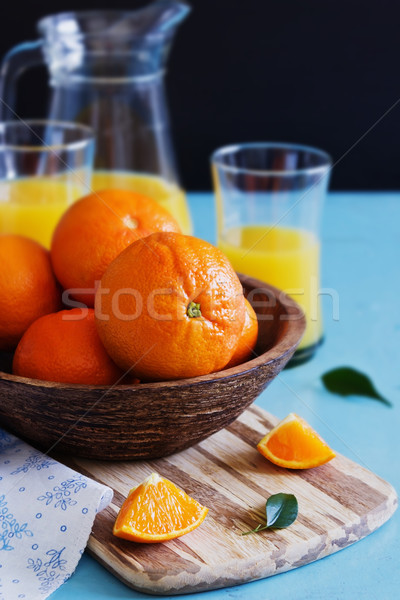 Stock photo: ripe oranges in a wooden bowl