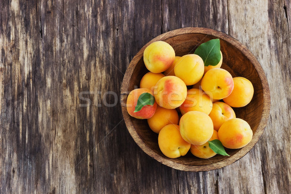 ripe apricots in a wooden bowl  Stock photo © saharosa