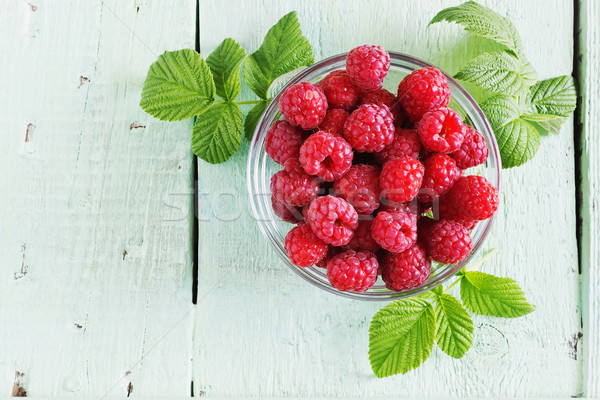 ripe juicy raspberries in a glass bowl  Stock photo © saharosa