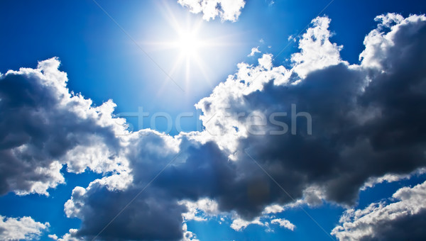 Soleil lumineuses bleu nuageux ciel [[stock_photo]] © sailorr