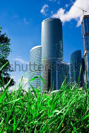 Felhőkarcolók fű új üzlet központ zöld fű Stock fotó © sailorr