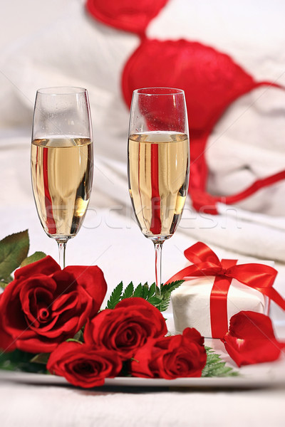 Champagne glasses and roses to celebrate Valentine's Day  Stock photo © Sandralise