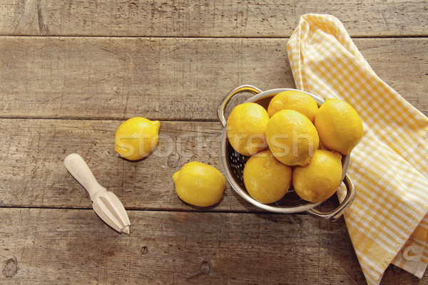 Fresh lemons on wooden counter Stock photo © Sandralise