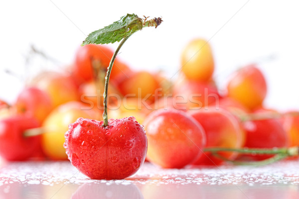 Sweet cherries with droplets isolated on white Stock photo © Sandralise