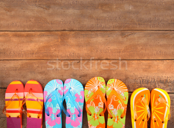 Brightly colored flip-flops on wood  Stock photo © Sandralise