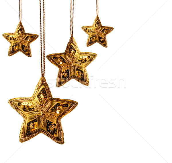 Gold beaded stars isolated on white Stock photo © Sandralise