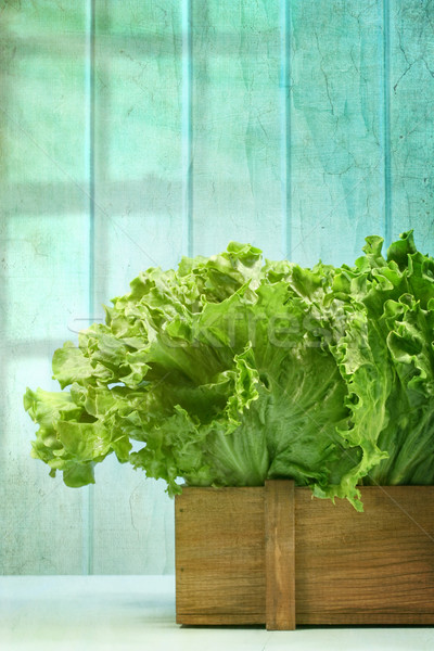 Lettuce in wooden box against grunge background Stock photo © Sandralise