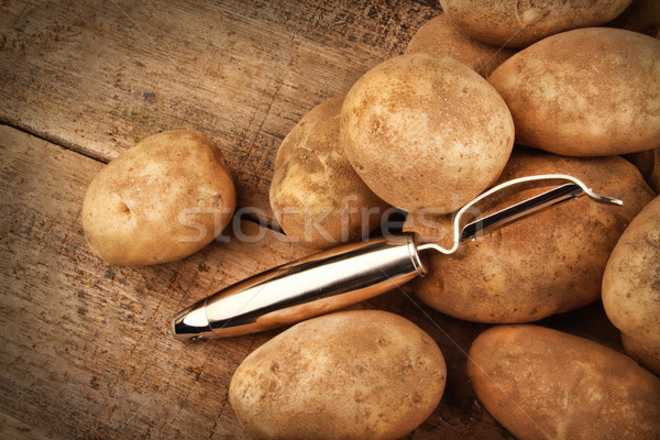 Harvest potatoes on wood Stock photo © Sandralise