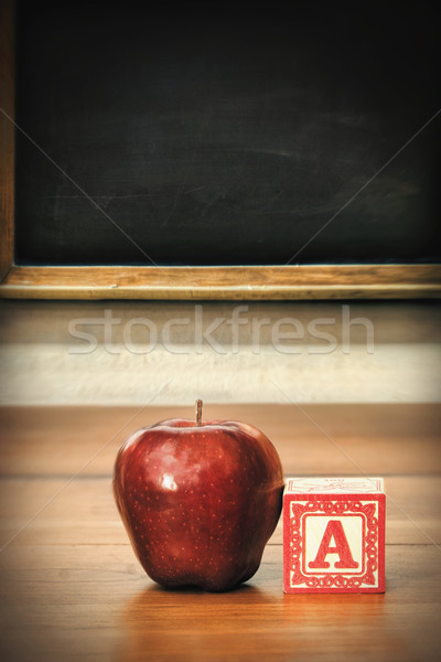 Stock photo: Delicious red apple on school desk